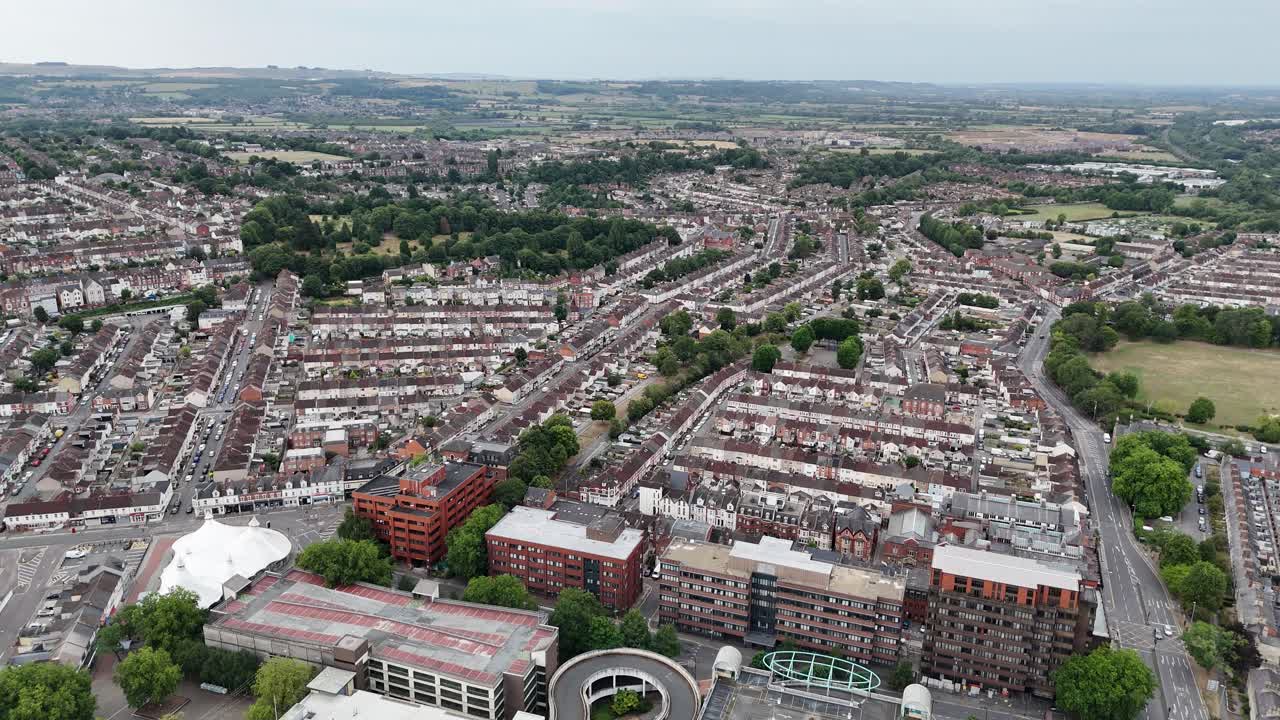 Ascending drone,aerial Swindon Town Wiltshire UK housing estate in background
