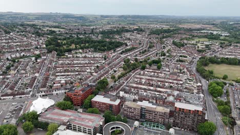ascending drone,aerial swindon town wiltshire uk housing estate in background
