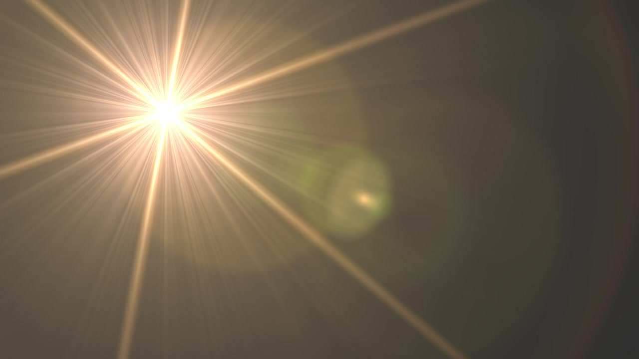 Una luce brillante che risplende su uno sfondo scuro. La luce è focalizzata su un piccolo punto, creando un senso di profondità e dimensione