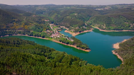 beautiful landscape drone footage from a very old town in central portugal, surrounded by a river