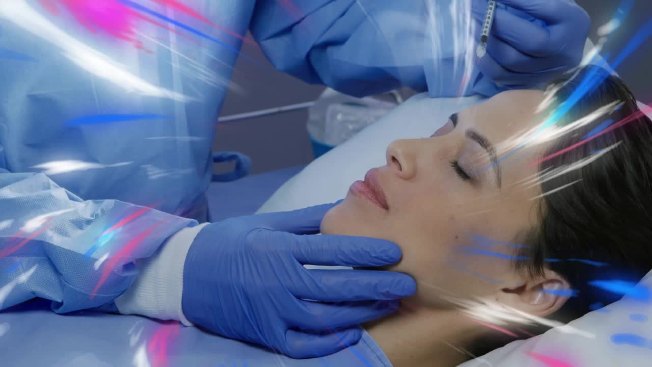 Doctor stabilizing patient head and injecting facial filler with syringe under vivid light streaks