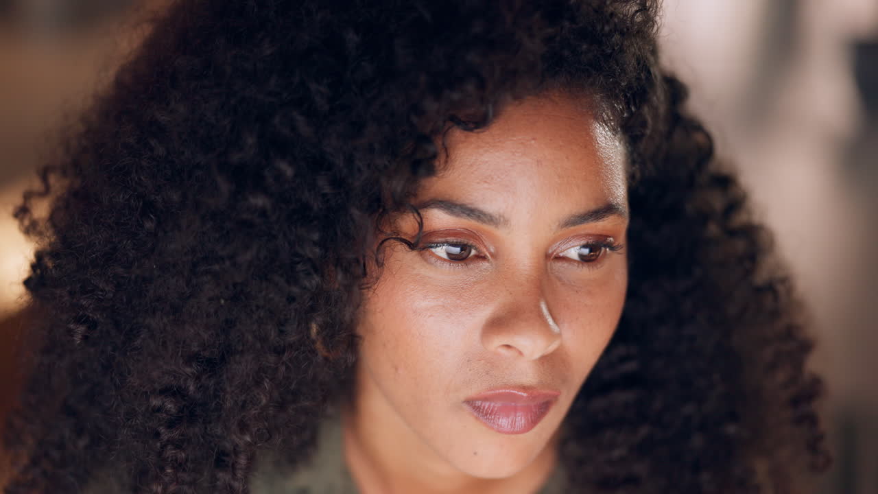 Close-up portrait of a woman with curly hair