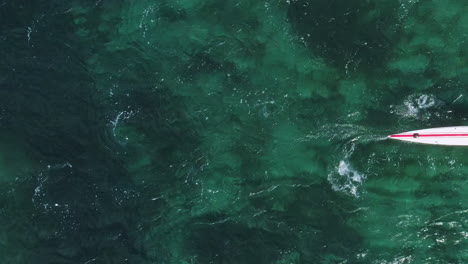 Overhead-shot-of-a-surf-ski-race-competitor-on-the-blue-water