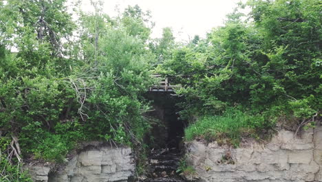 close-up shot of the valaste waterfall and the viewing bridge above