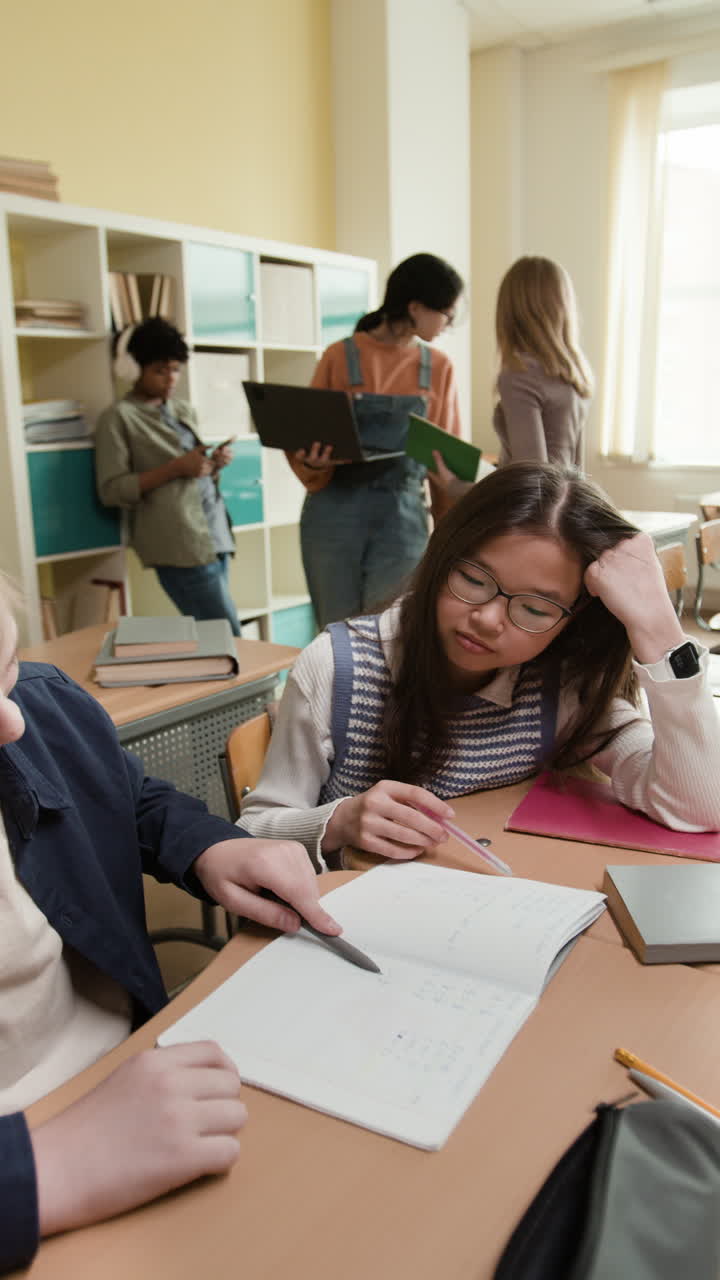 Students working and interacting in a classroom
