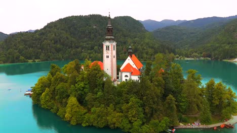 stunning drone footage of lake bled, slovenia, showcasing the iconic island, castle, and lush landscapes