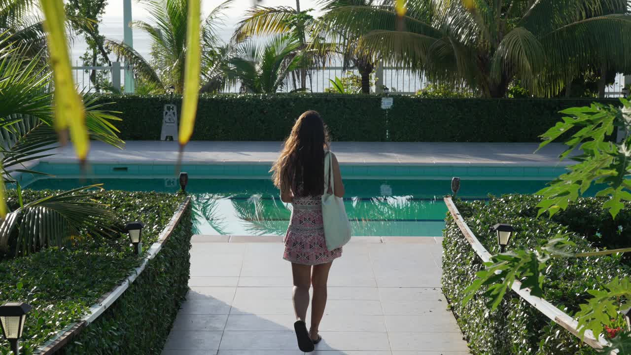Young woman on holiday, private pool resort tropical landscape San Andres island Colombia