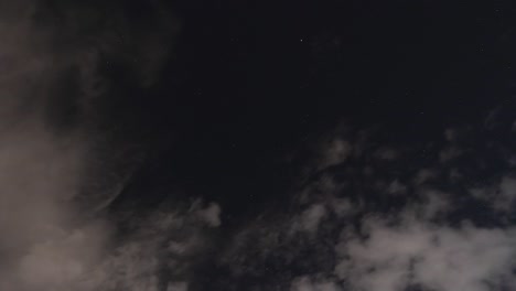 night sky timelapse with many stars and satellites, after the clouds cover the sky