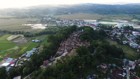 tradtional thatched roof cottages over countryside villages in sumba island, east nusa tenggara, indonesia