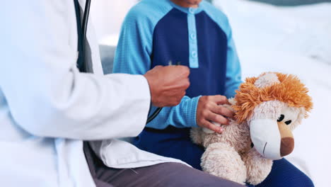 Doctor,-hands-and-stethoscope-for-child-with-toy