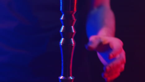 Hookah smoking in a dark club setting