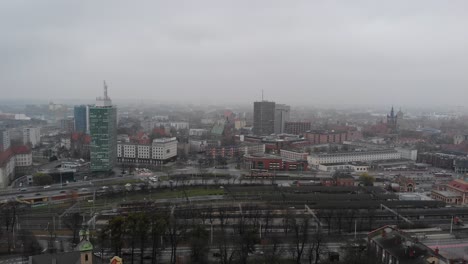 Aerial-view-on-railroad-station-and-downtown-of-Gdansk,-Poland-on-autumn-day