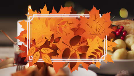 Animation-of-white-frame-and-autumn-leaves-over-thanksgiving-dinner-background