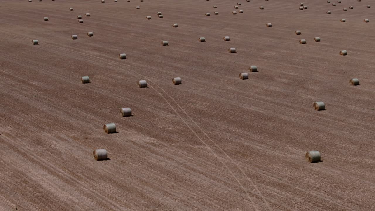 Aerial farmland background with hay bales and wide open space