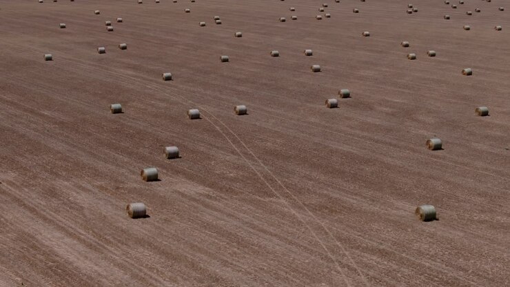 Aerial farmland background with hay bales and wide open space