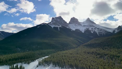 aerial view of three sisters mountain peaks, canmore, alberta, canada - drone 4k