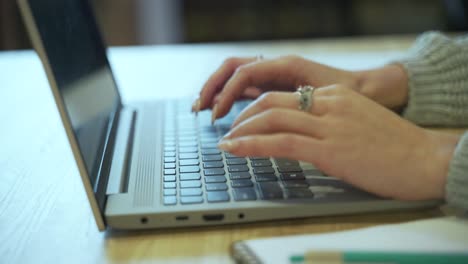 young female hands of business woman professional user worker using typing on laptop notebook keyboard at home office desk working