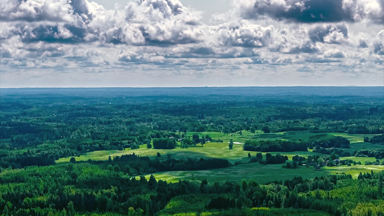 Cloudy sky timelapse shadow over green forest nature country park outdoor hyperlapse Latvia