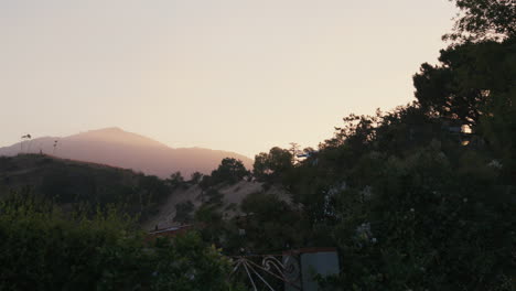 Slow-motion-wide-shot-of-sunrise-over-mountains