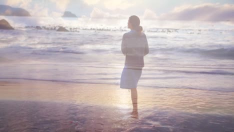 woman walking on the beach at sunset 4k