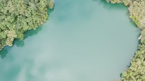 Top-view-of-water-channel-with-Spectacular-View-of-Feitsui-Reservoir,-Emerald-lake,-Thousand-Island-Lake-is-Second-largest-water-reservoir-dam-water-supply-in-Taiwan-and-mountainous-view