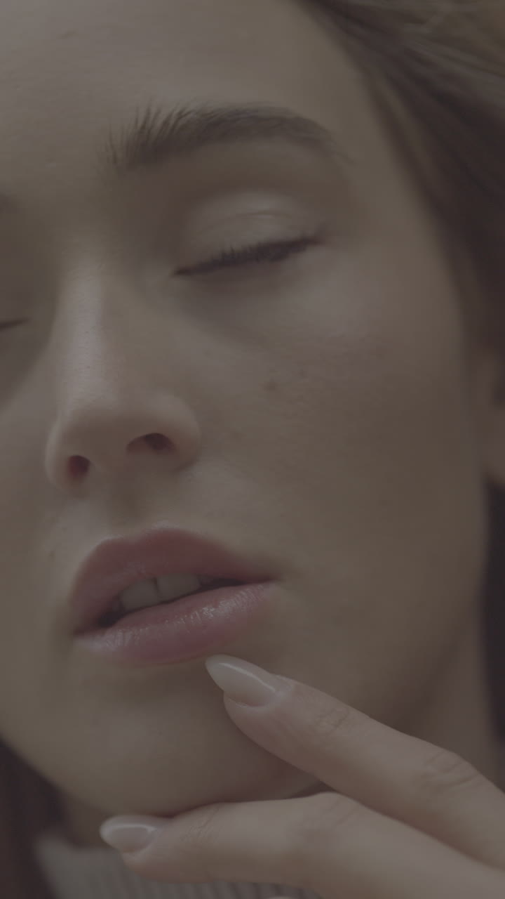 Close-up portrait of a woman wearing a ring
