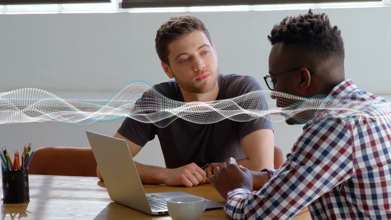 Left man leaning while right man speaking and causing waveform moving across laptop for business