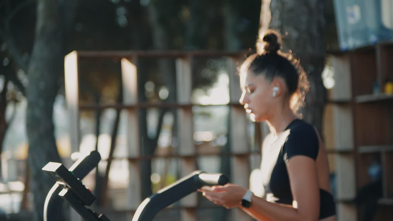 Woman Exercising on Treadmill Outdoors
