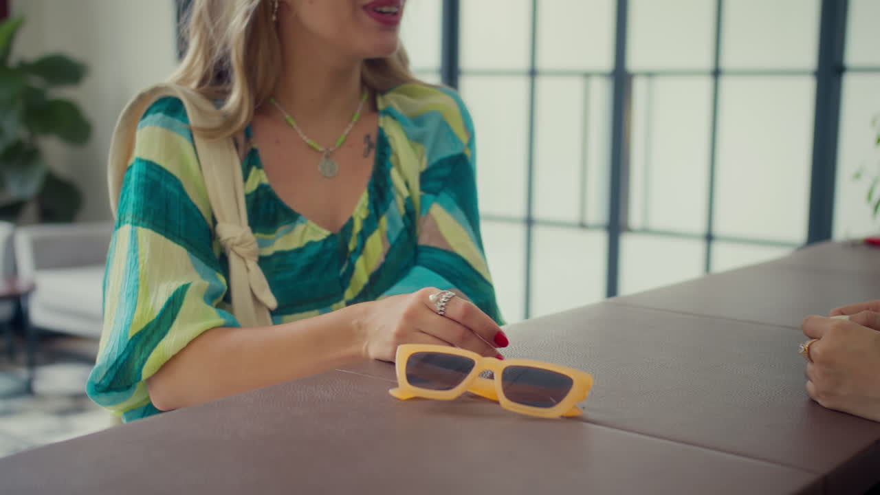 Female Tourist Giving Passport to Hotel Receptionist