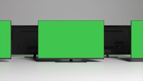 multiple flat screen tvs with green screens