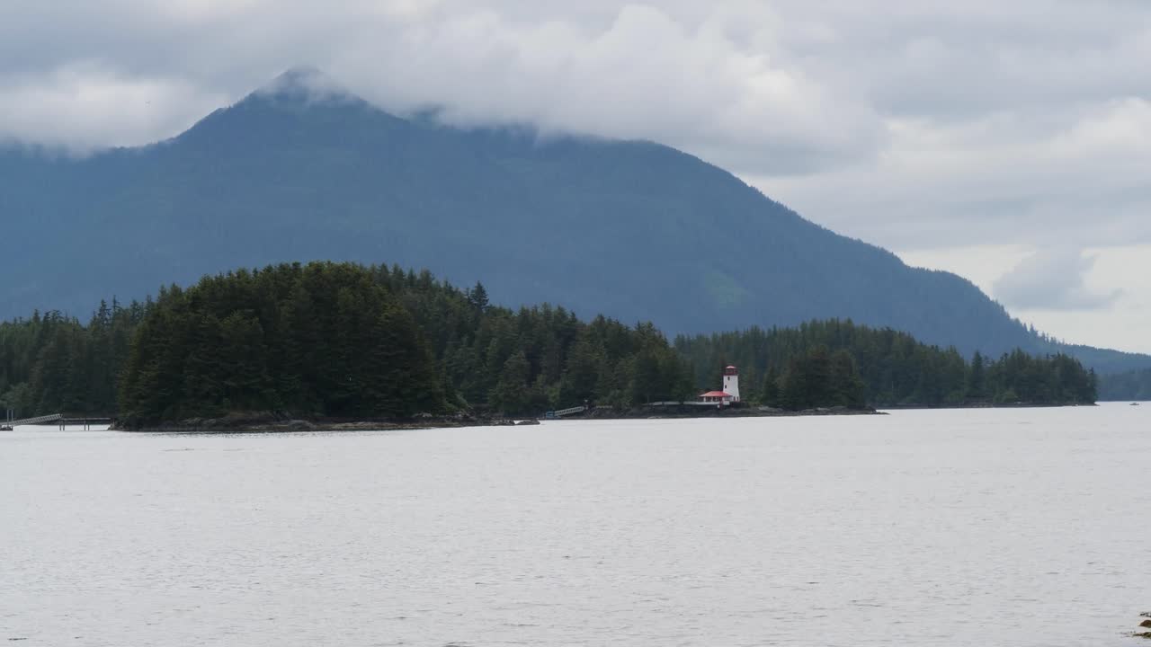 Sitka Lighthouse, Galankin Island, Alaska.Mount Kinkaid covered by clouds.