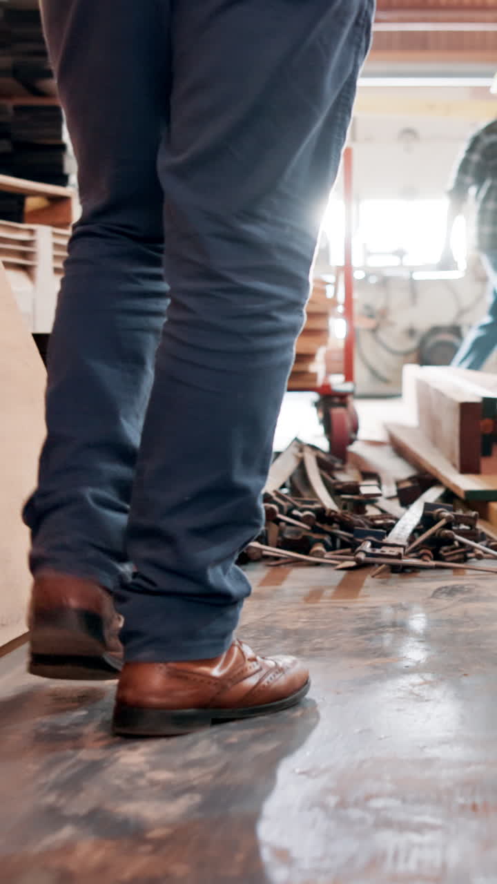 Low Angle View of Worker's Feet Moving in a Workshop