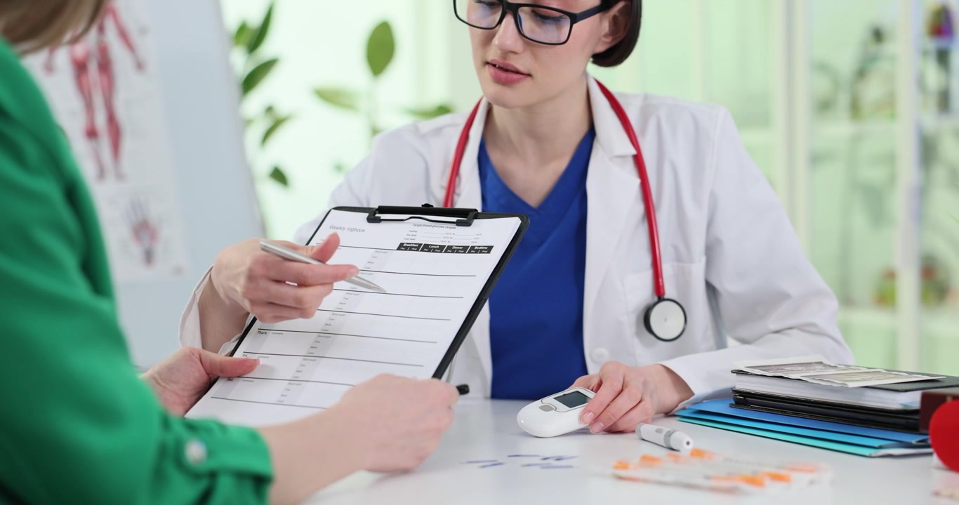 Doctor shows pulse oximeter and tests result to patient in clinic