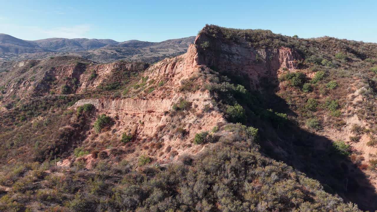 Low-altitude drone footage capturing a rugged ridge in Black Star Canyon, California