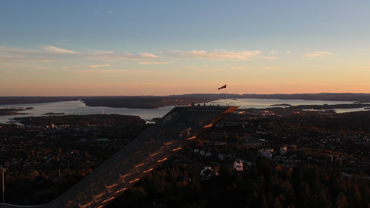 Aerial Drone shot at dusk of world famous Ski jumping hill in Holmenkollen. Holmenkollen in Oslo, Norway.