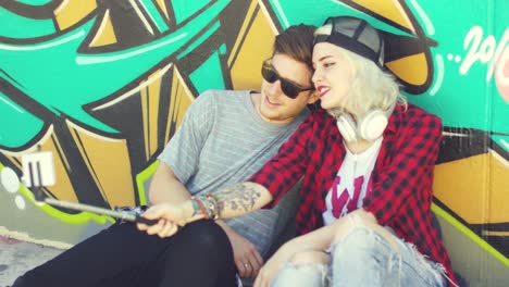 trendy young hipster couple taking a selfie