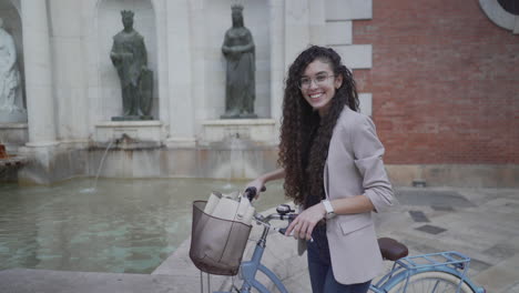 woman on a bike in a city center