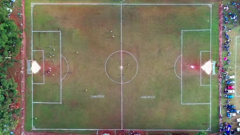 Drone-aerial-view-of-a-football-match-between-two-teams-at-the-border-between-Brazil-and-Argentina