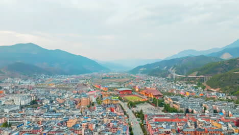 aerial view of a city nestled in a mountain valley