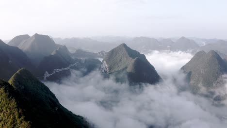 Amazing-cloudy-karst-mountain-landscape,-Getu-valley-in-China,-aerial-view