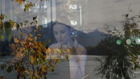 thinking by serene lake, woman surrounded by autumn leaves and mountains