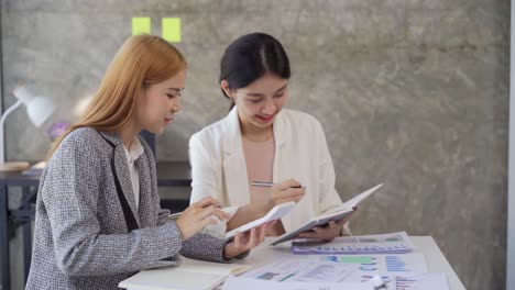 confident young female mentor corporate leader manager counselor communicate with multiracial business professional team people teaching interns staff group engaged in discussion at training meeting