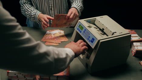 specialised police officer counting dollar banknotes in crime lab, conceptual image. high quality 4k footage