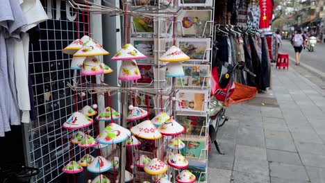 street vendor selling traditional vietnamese hats