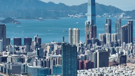 4k tele zoom view of hong kong central district - slow pan aerial view angle from sky.