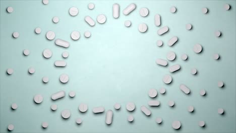 stop motion animation white pills on a blue background, top view. medical drugs empty space in the centre. tablet 4k stock videos and footage