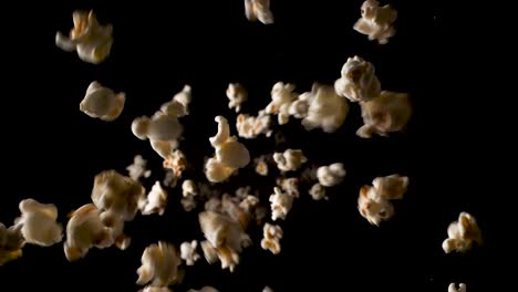 slow motion fall of popcorn until the whole frame is covered with it