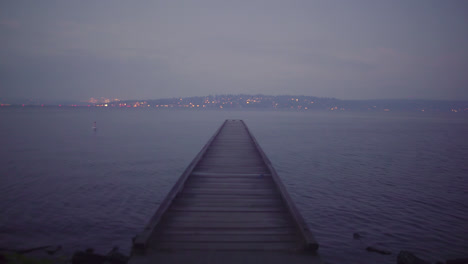 empty dock on lake washington in seattle during a foggy night