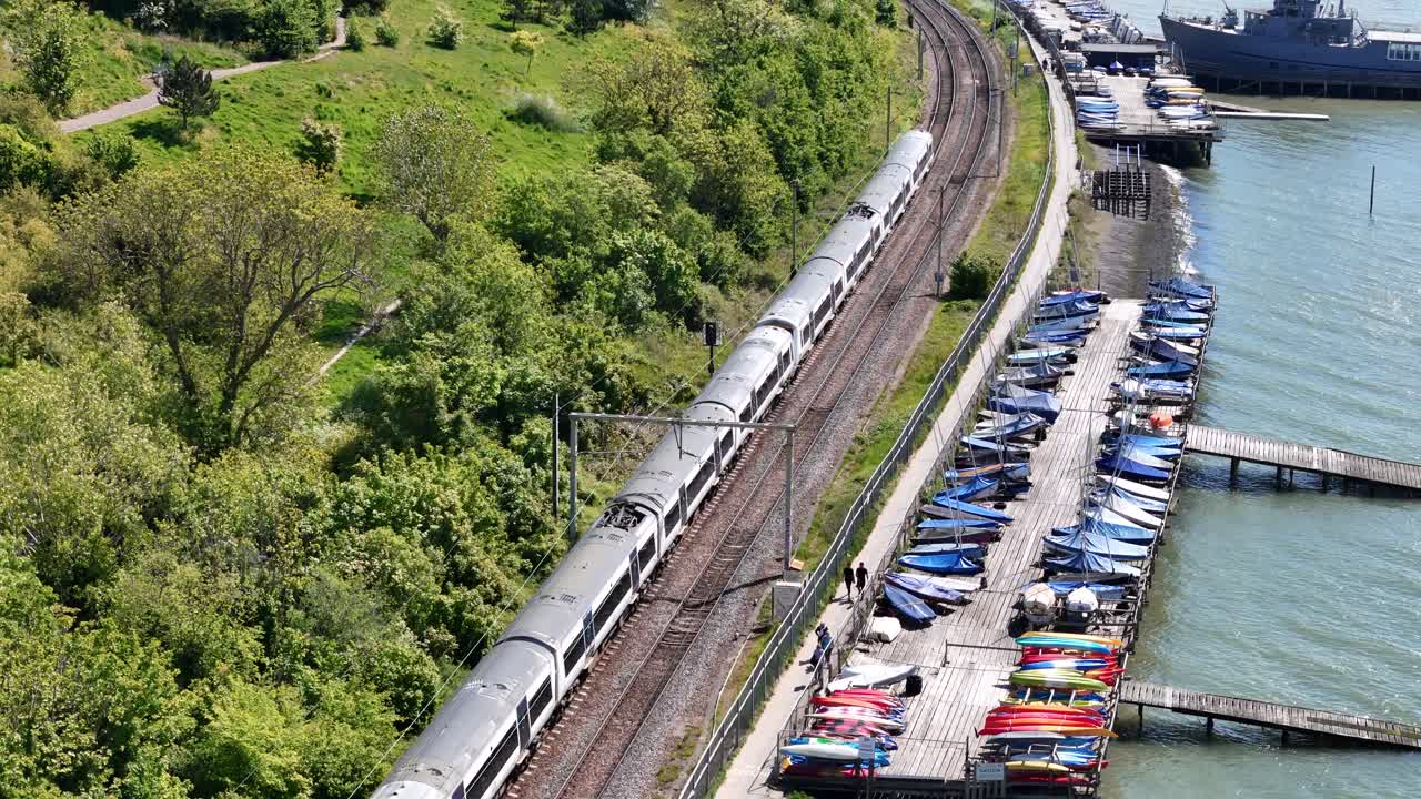 Drone tracking train on coastal railway Leigh on Sea Essex UK