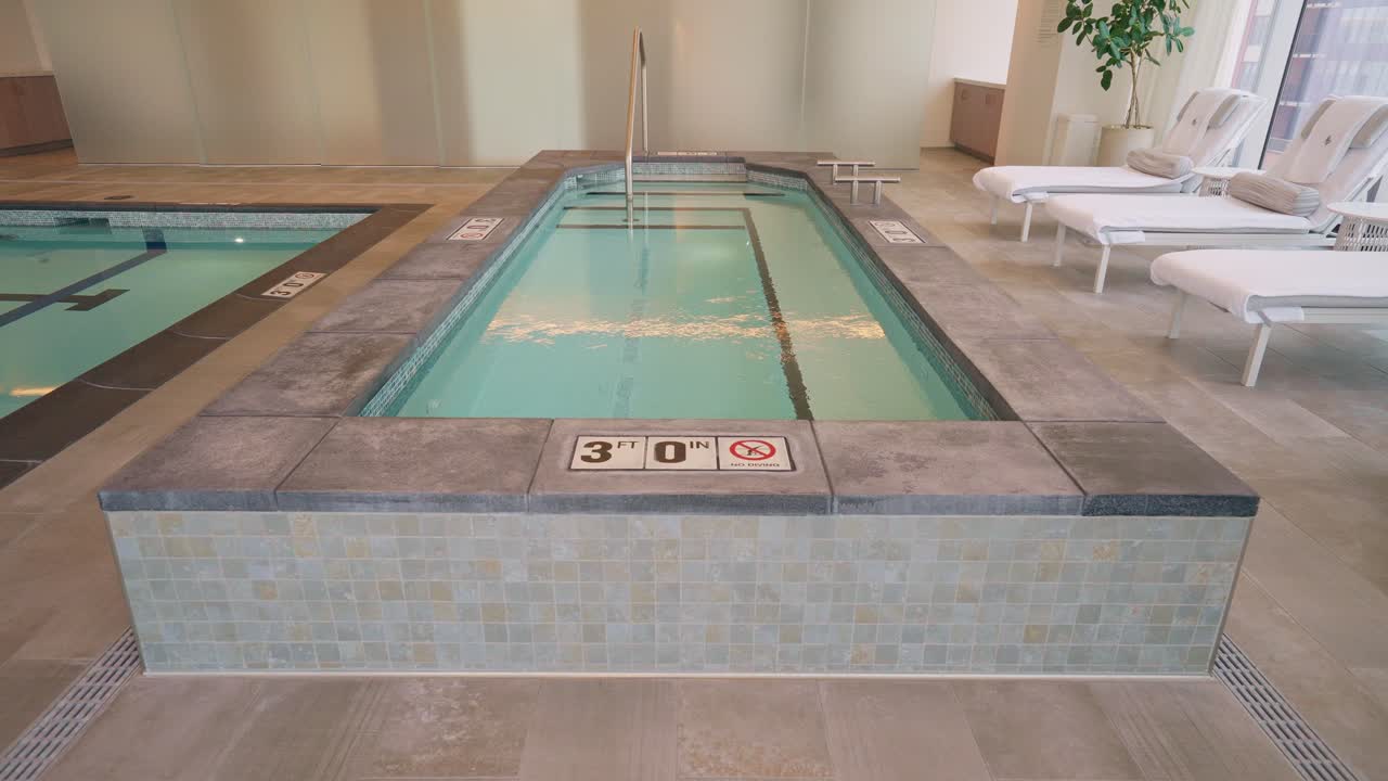 Close-up push-in shot of a luxurious hotel's hot tub, inviting relaxation and comfort